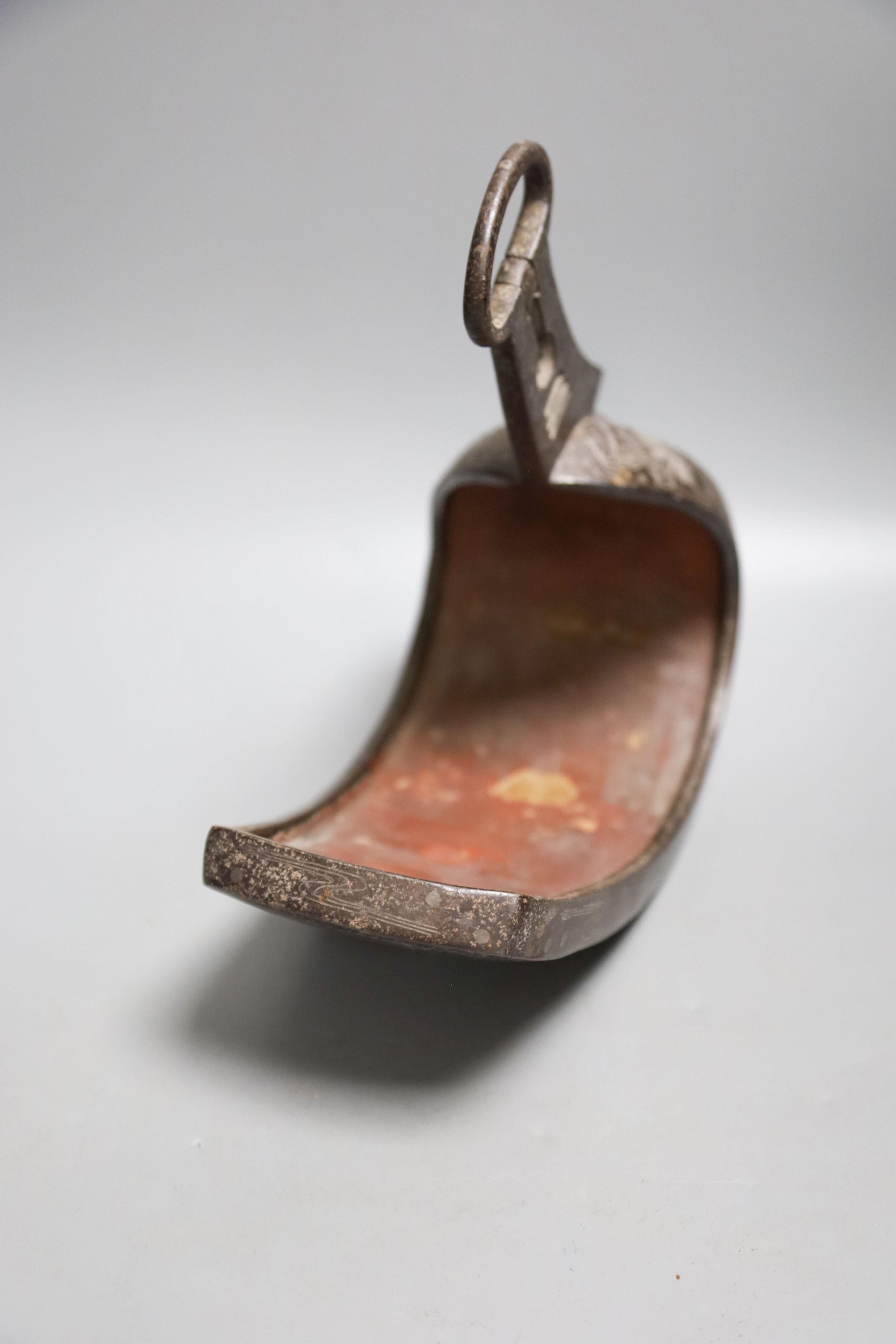 A Japanese Edo period silver-inlaid iron stirrup, 27cm